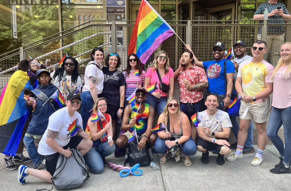 Jenna Mechalas, kneeling, far left, with a group of Penn Medicine employees at the Philadelphia Pride March